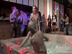 Mud wrestling with messy clothed cuties