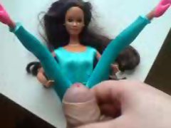 Barbie in tight blue dress gets some cum.