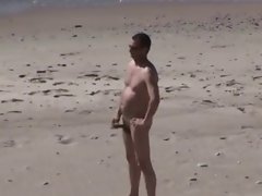 A Voyeur films a couple on beach