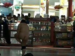 Asian female naked inside airport